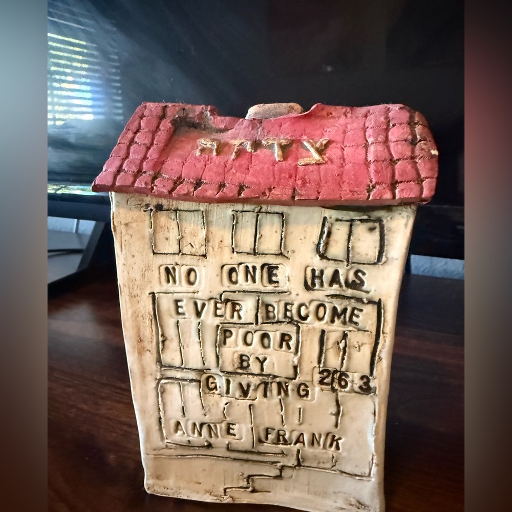Vintage Anne Frank Tzedakah piggy bank. Signed. Approx. 7” tall made of clay.